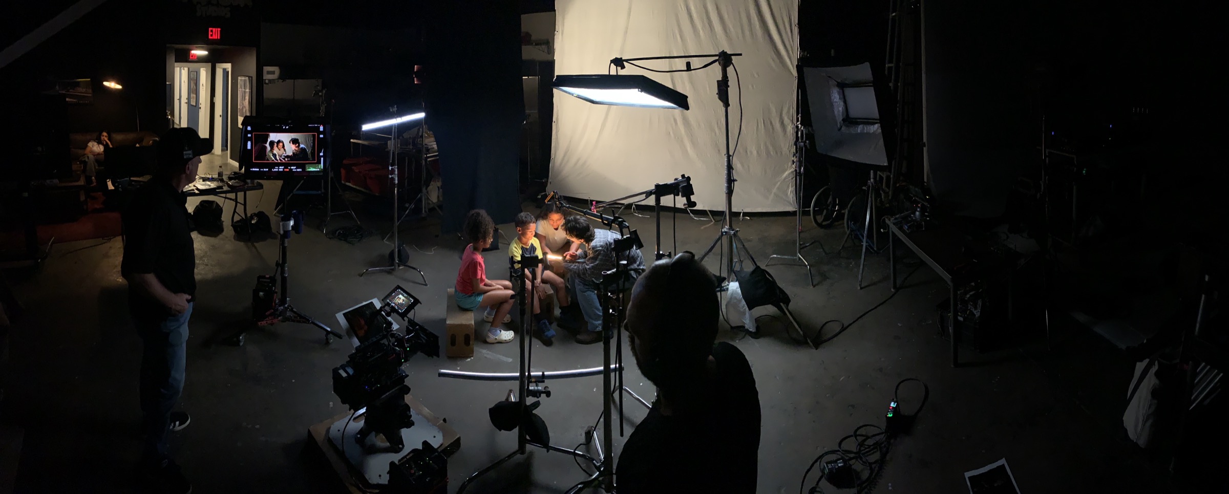 The lit stage, wide, during the shoot